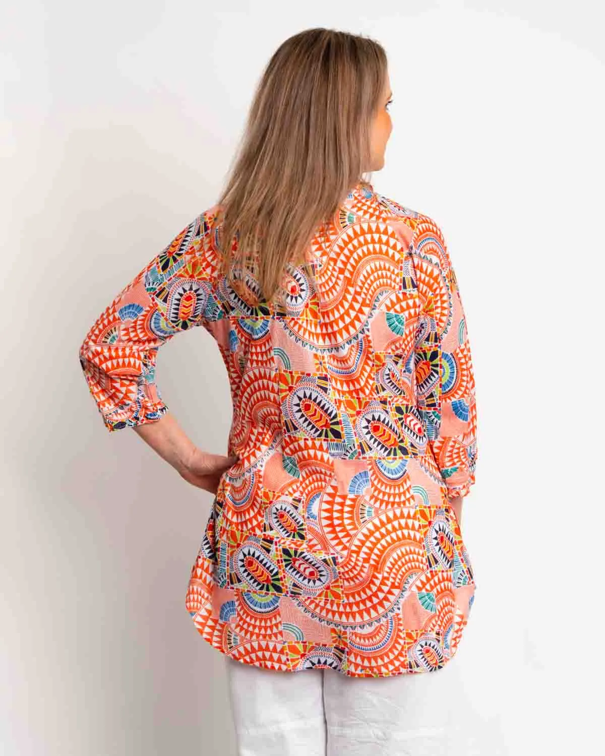 Long Pleated Top with Subtle Frills and 3/4 Raglan Sleeve in Orange Geo