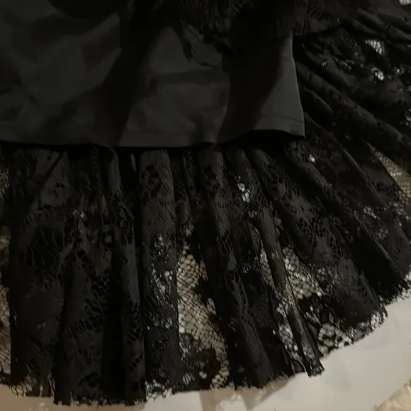 Size 6 Max and Cleo Lace black dress with ruffle detail. Fitted mini dress